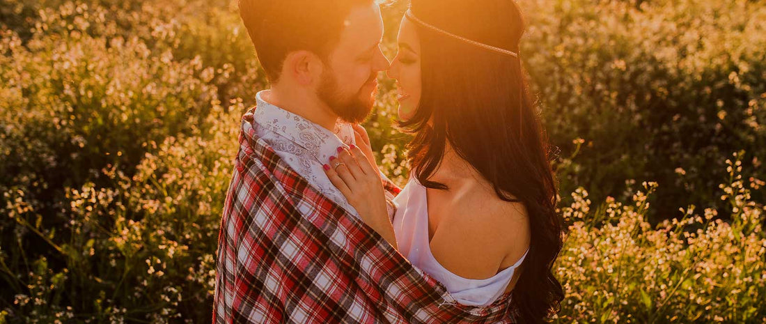 husband and wife wrapped in blanket together