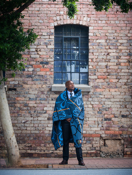 a man is wrapped with wool blanket by thula tula